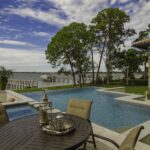 luxurious backyard with a pool and outdoor seating